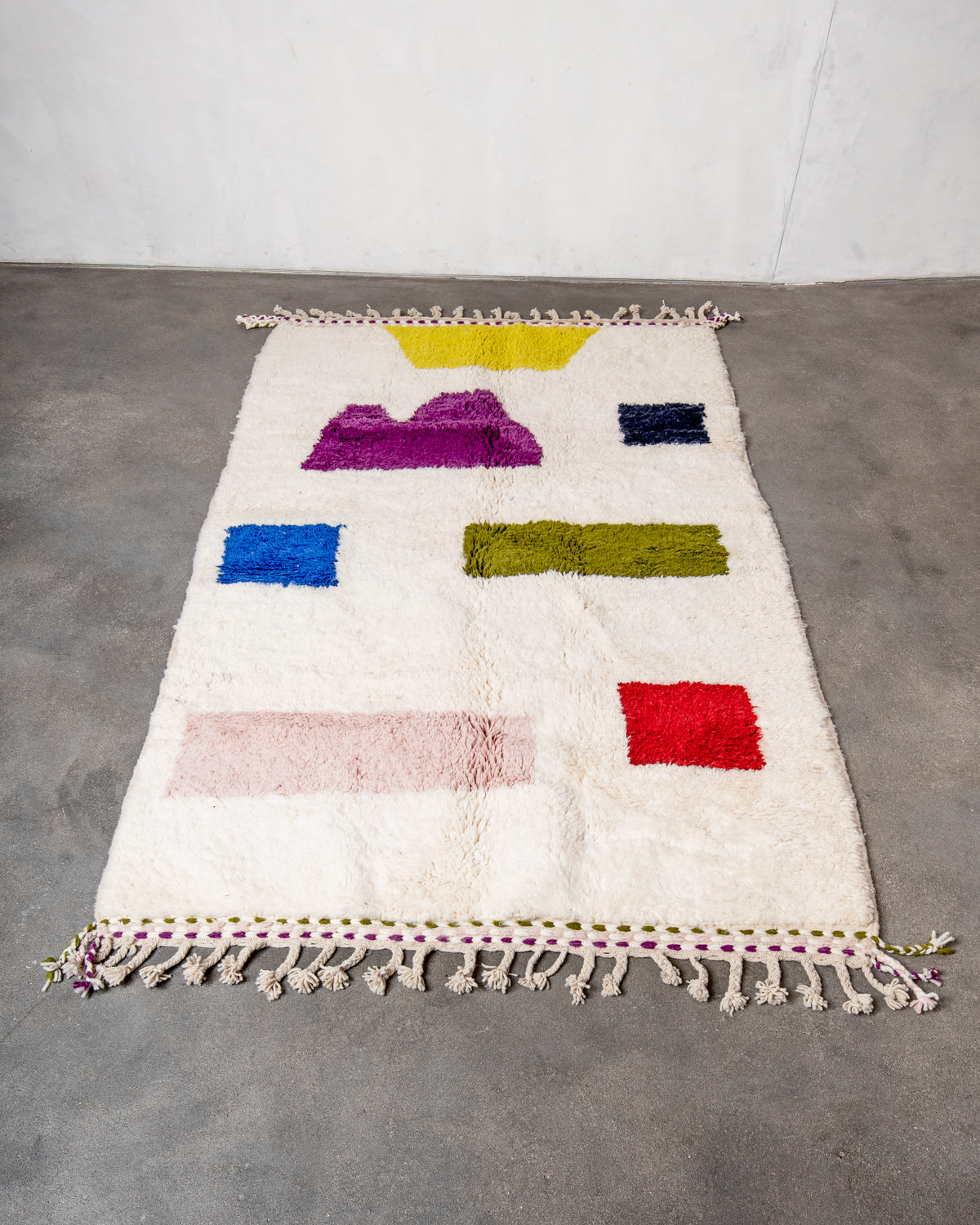 Modern, designer, handcrafted Berber rug from Morocco. Beniourain carpet with beautiful colours and patterns and fluffy wool texture.